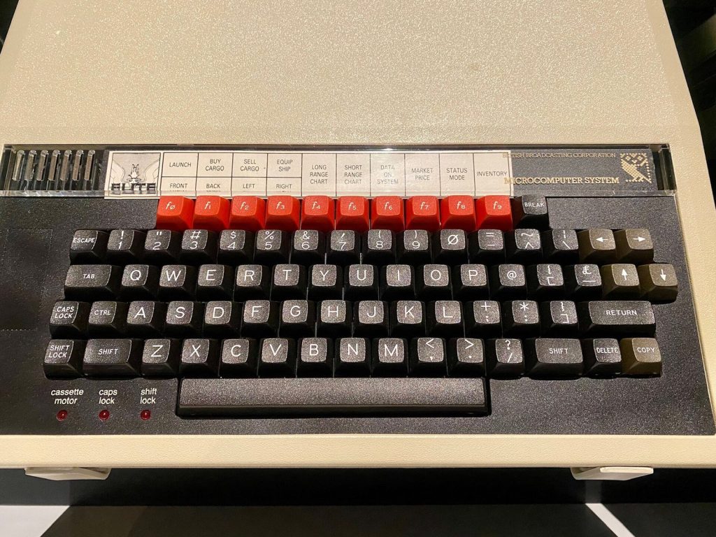 BBC Micro keyboard with an Elite function-key strip reading Launch, Buy Cargo and Inventory