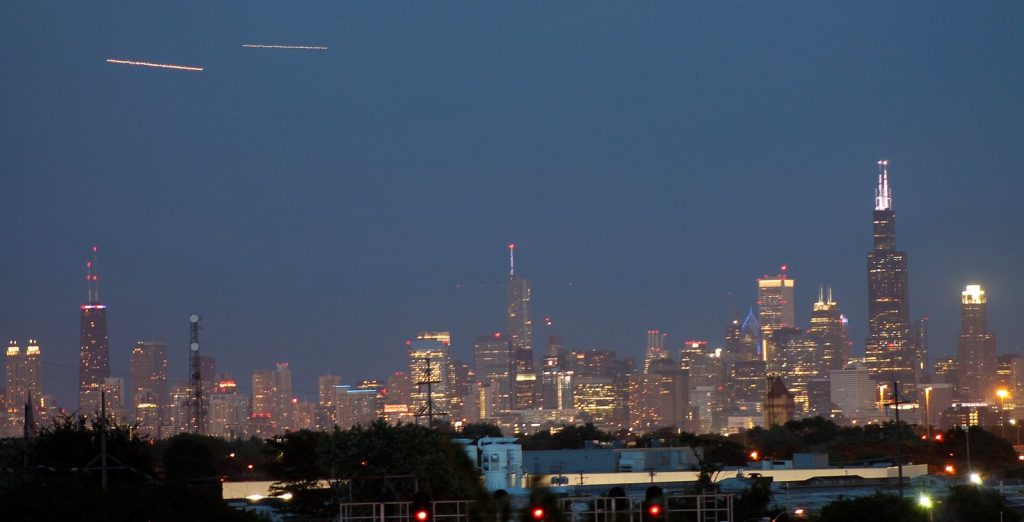 Chicago skyline lit up at night seen from across the water